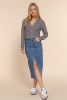 Full outfit view of gray cropped cardigan styled with denim midi skirt and sneakers-AVAH