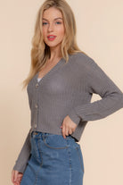 Side angle of cropped gray cardigan styled with denim skirt-AVAH