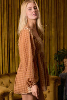 Side view of velvet romper with relaxed flared shorts and long sleeves-AVAH