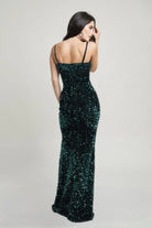 Back view of emerald green sequin gown with straight back and floor-length skirt