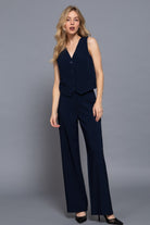 Full body image of model in navy vest and coordinating straight leg trousers-AVAH