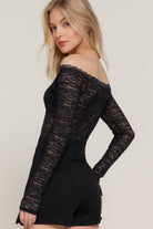 Back view of black off-shoulder lace long sleeve top.