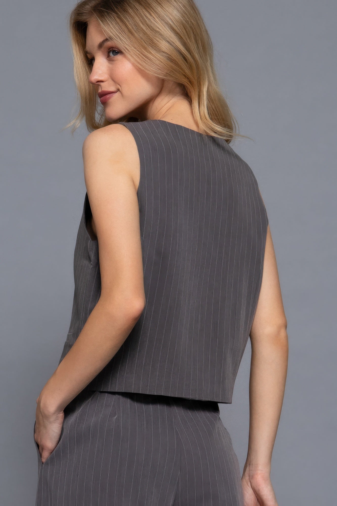 Back view of charcoal tailored vest with vertical stripes-AVAH