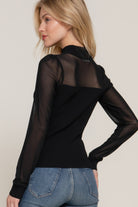 ack of ribbed knit sweater top featuring clean lines and subtly rounded hem.