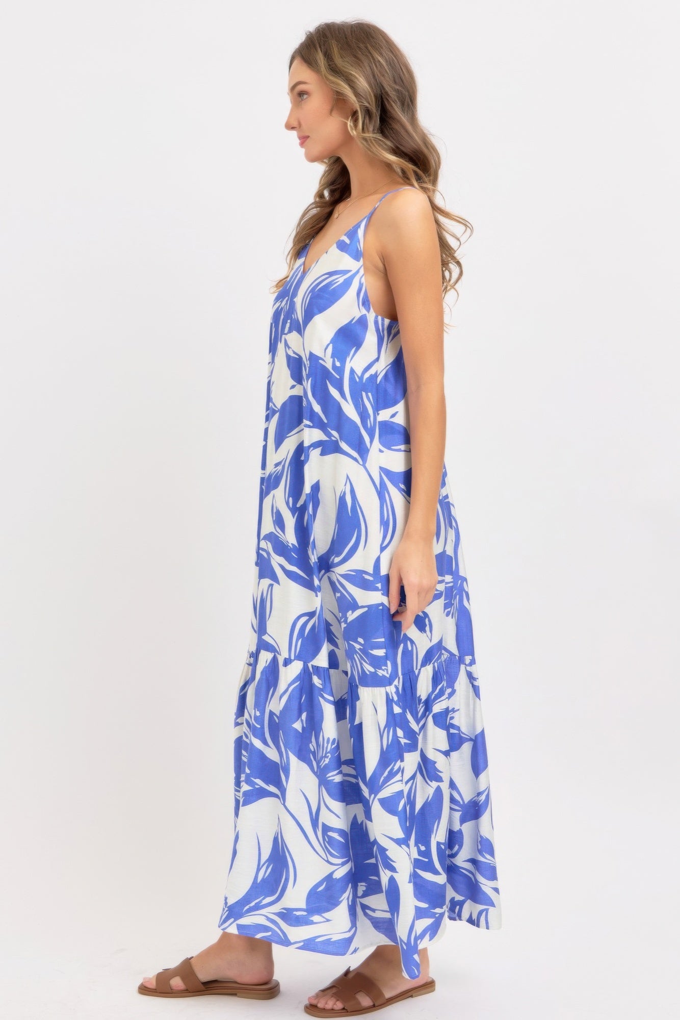 Side profile of blue and white flowy maxi dress
