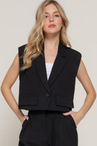 Model wearing a black lapel collared vest-AVAH