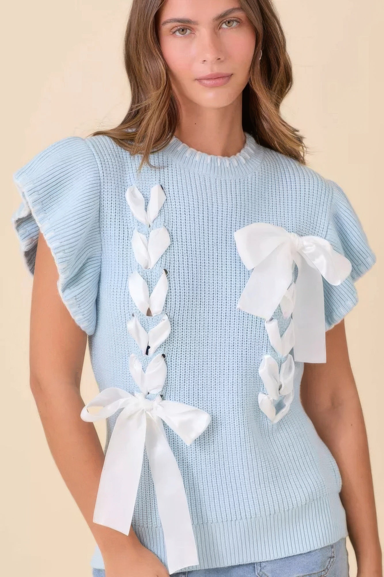 Front view of baby-blue ribbon-detail knit sweater with satin bows and flutter sleeves-AVAH
