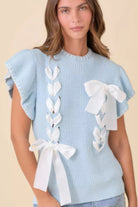 Front view of baby-blue ribbon-detail knit sweater with satin bows and flutter sleeves-AVAH