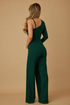 Rear angle of emerald jumpsuit showing asymmetrical neckline and tailored fit