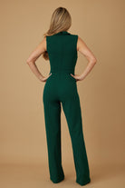 Rear angle showing clean back silhouette and tailored seams of emerald green jumpsuit