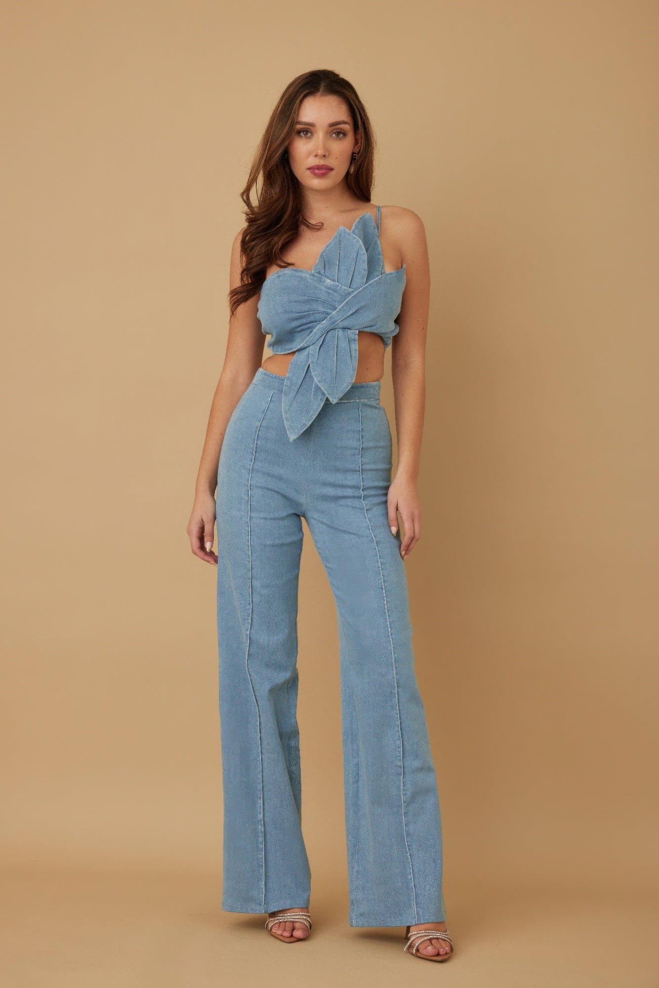 Blue wrap crop top and flare pant set front view with petal drape detail

