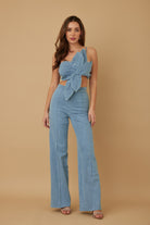 Blue wrap crop top and flare pant set front view with petal drape detail
