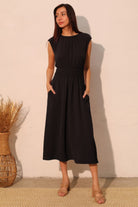 Black midi dress with smocked waist and cap sleeves

