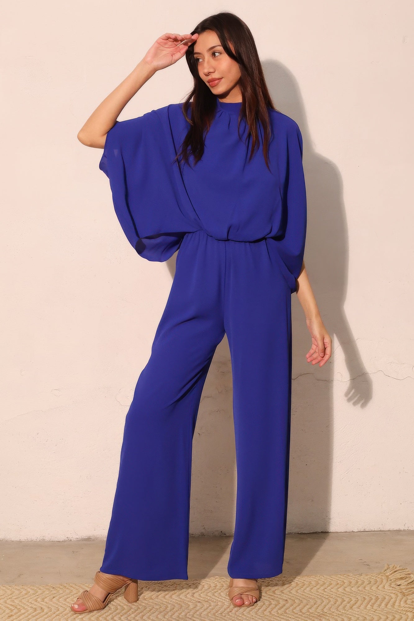 Model wearing the Quiet Luxury Royal Blue Wide Leg Jumpsuit, AVAH