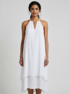White halter midi dress with gold front detail and tiered skirt