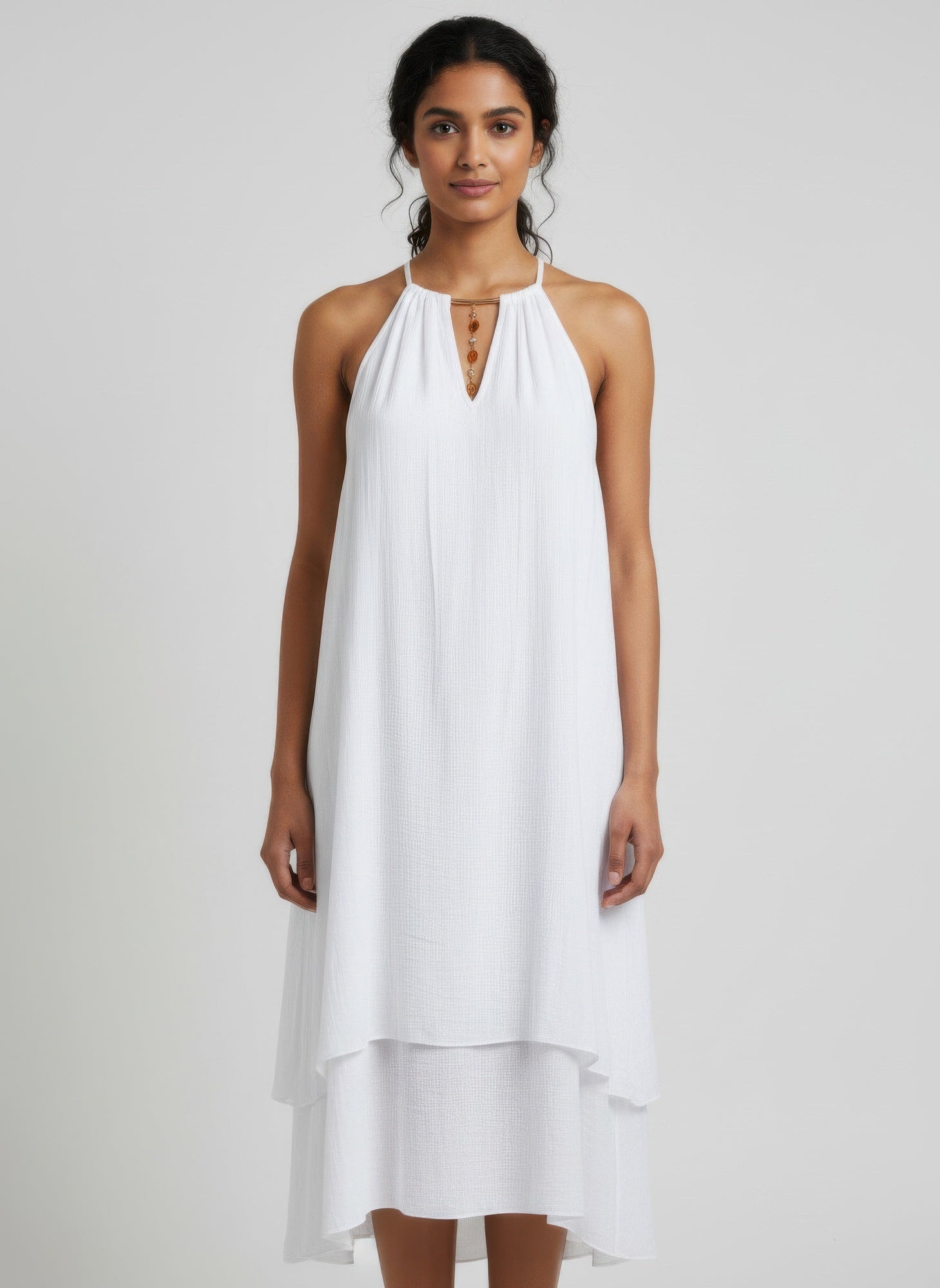 White halter midi dress with gold front detail and tiered skirt