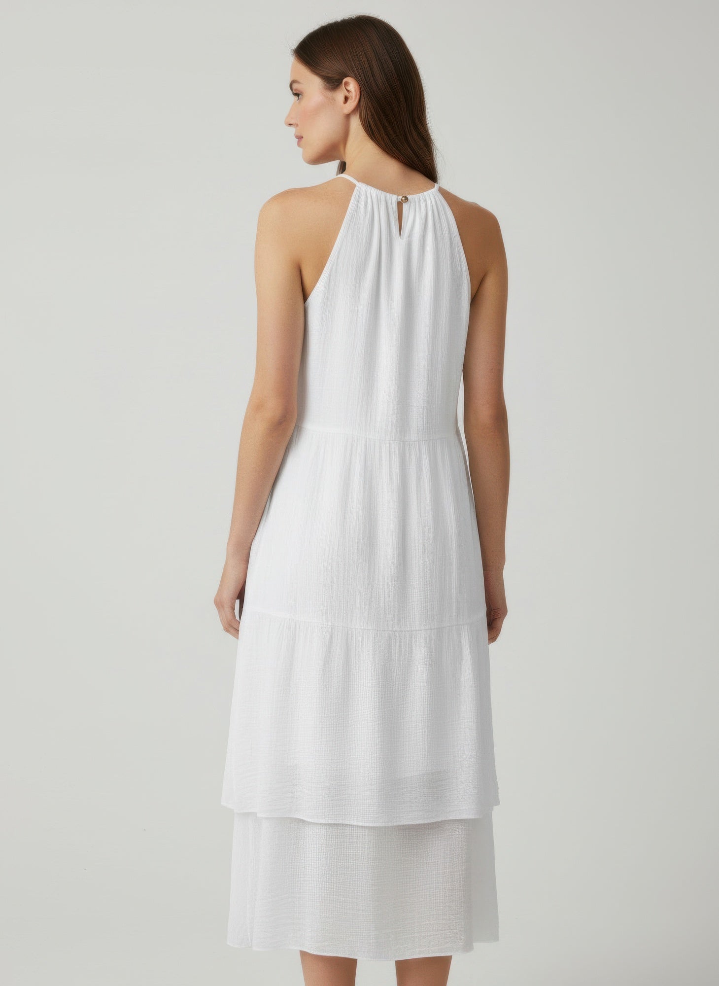 Back view white halter midi dress with keyhole closure and tiered design