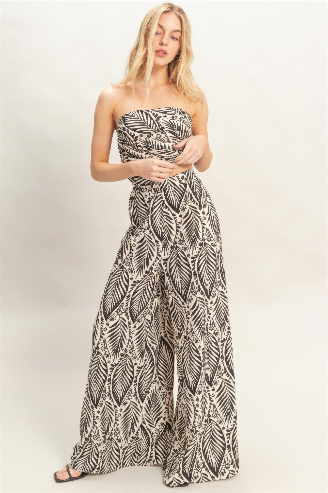 Front view of tropical print strapless top and wide leg pant set
