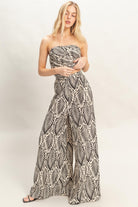 Front view of tropical print strapless top and wide leg pant set
