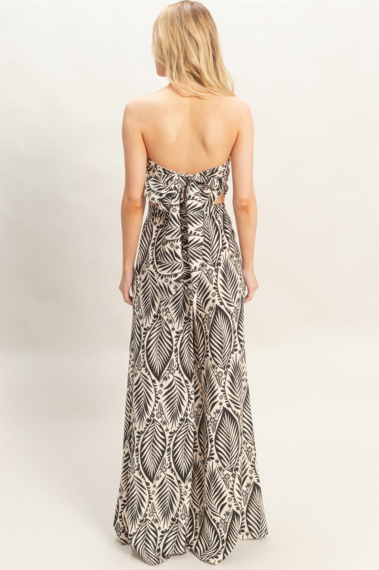 Back view of tropical print two piece pant set with bow tie back
