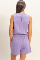 Back view of lavender sleeveless romper with elastic waist
