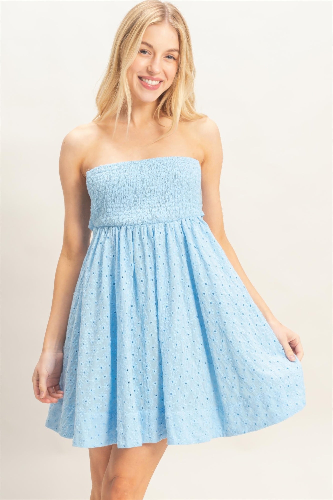 Front view of light blue strapless eyelet babydoll mini dress
