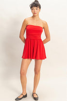 Red strapless mini romper with fitted ruched bodice full front view
