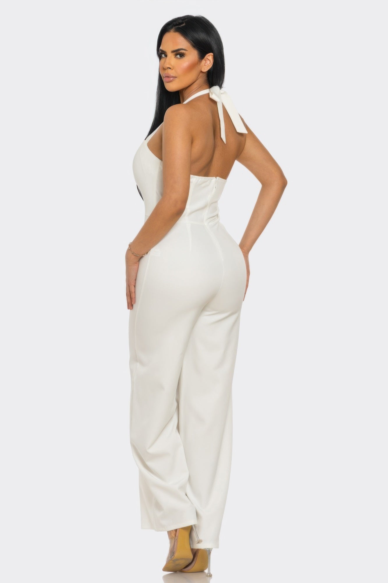 Off white halter wide leg jumpsuit with tie neck, open back and back zipper closure, rear view
