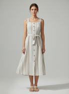 Model wearing striped cotton midi dress with minimal sandals-front view