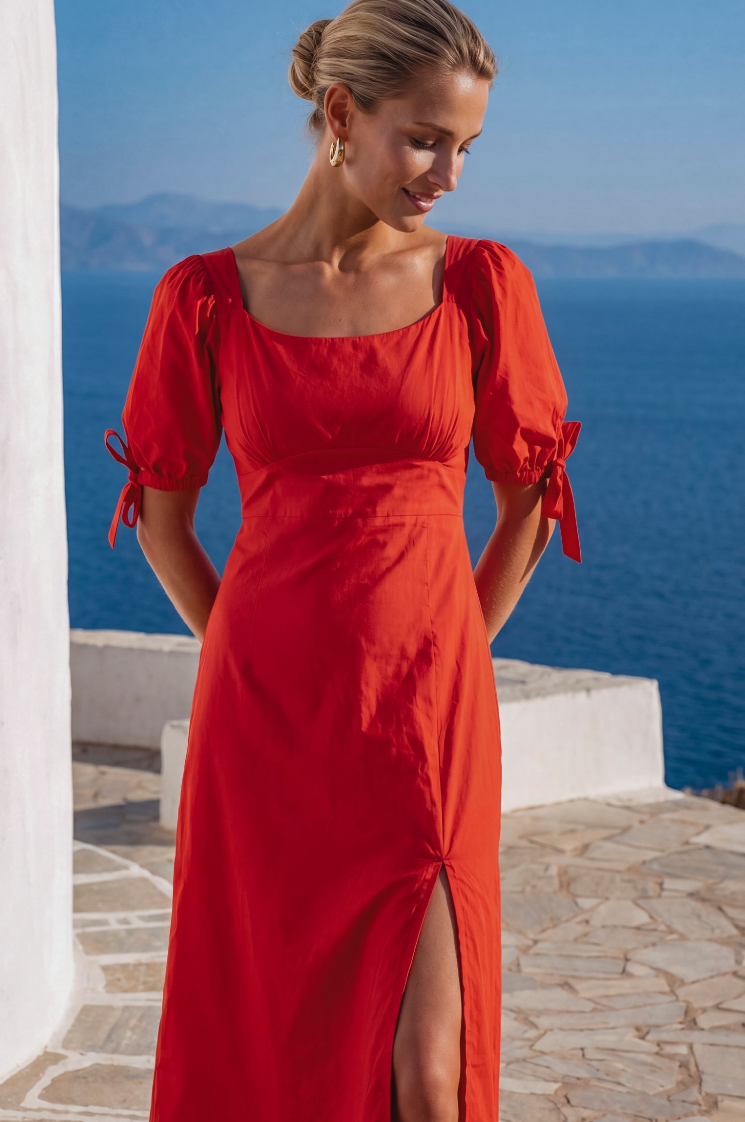 Front view of the Cala Luna Puff Sleeve Midi Dress in red featuring the fitted bodice, scoop neckline, and midi silhouette.