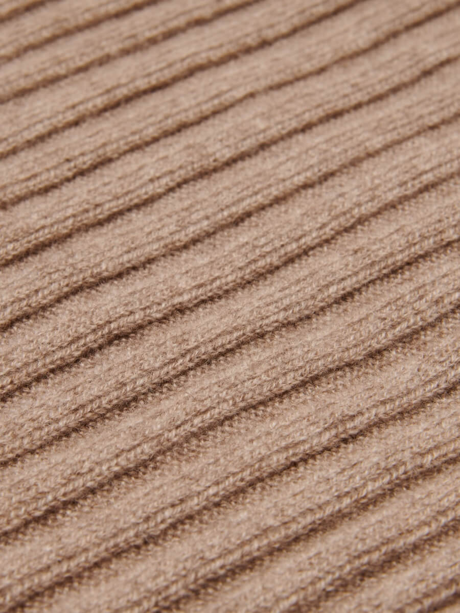Close-up of a textured brown cashmere  knit surface