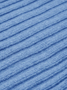 Close-up of blue textured cashmere fabric with horizontal lines