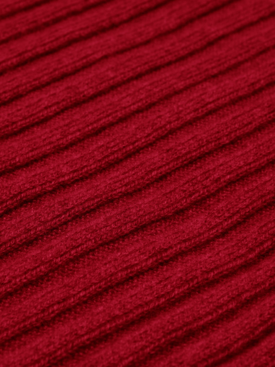 Close-up of red cashmere knit textured fabric