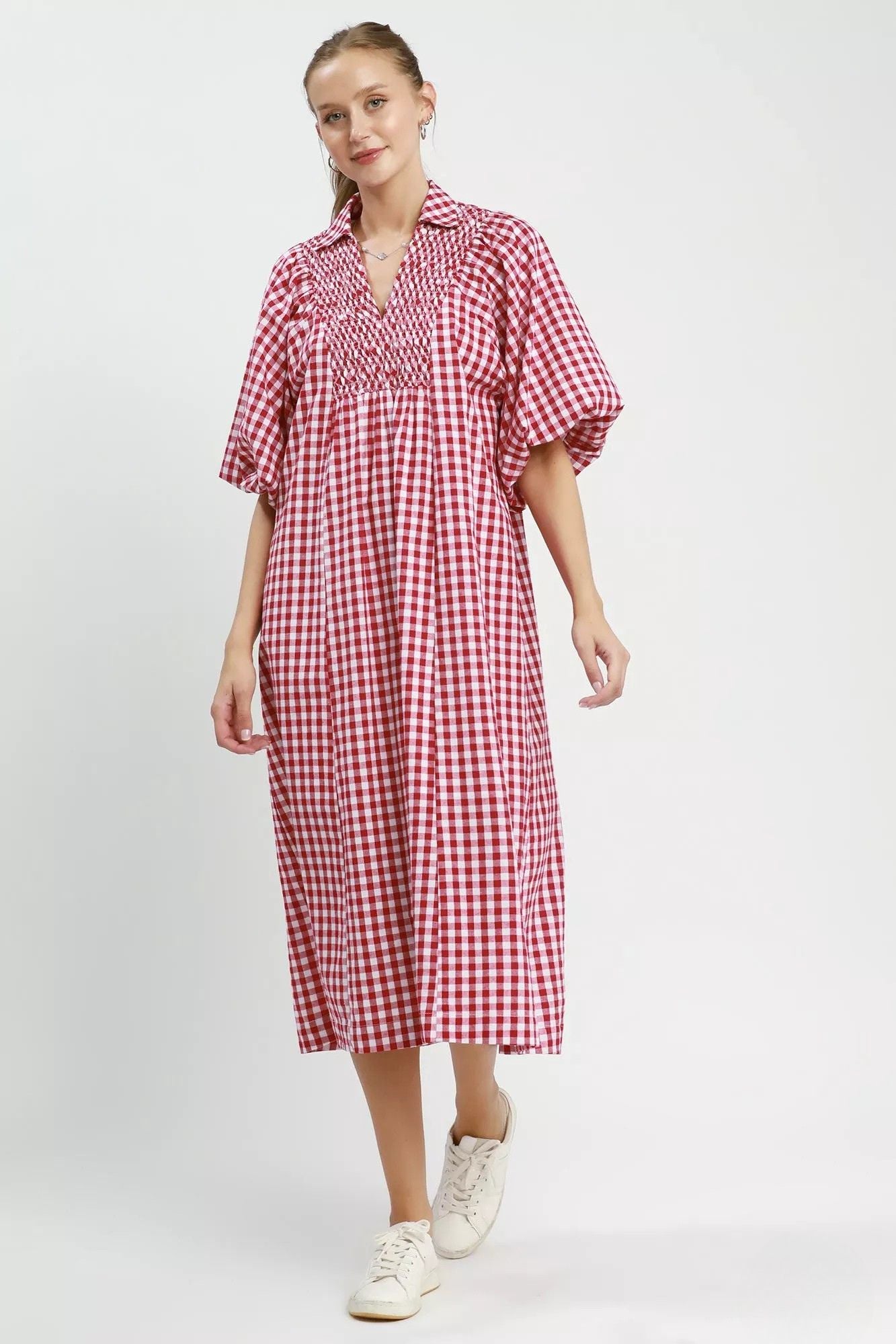  Full length front view of cherry check gingham midi dress styled with white sneakers, AVAH