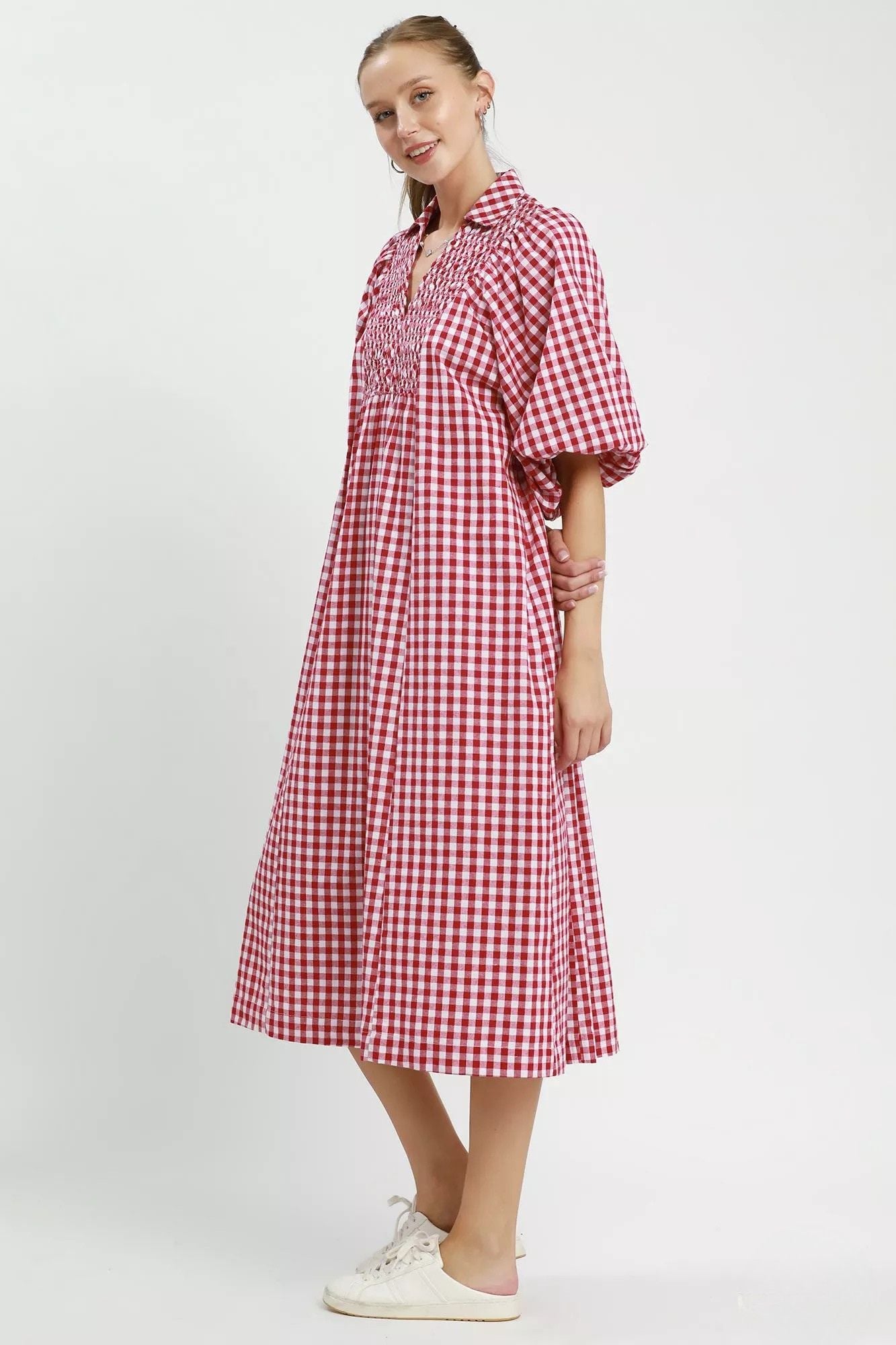  Side view of crimson gingham puff sleeve midi dress with smocked bodice and full skirt, AVAH