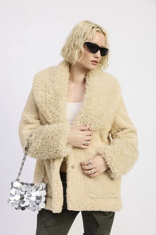 Woman posing in beige taupe teddy coat and dark sunglasses-AVAH