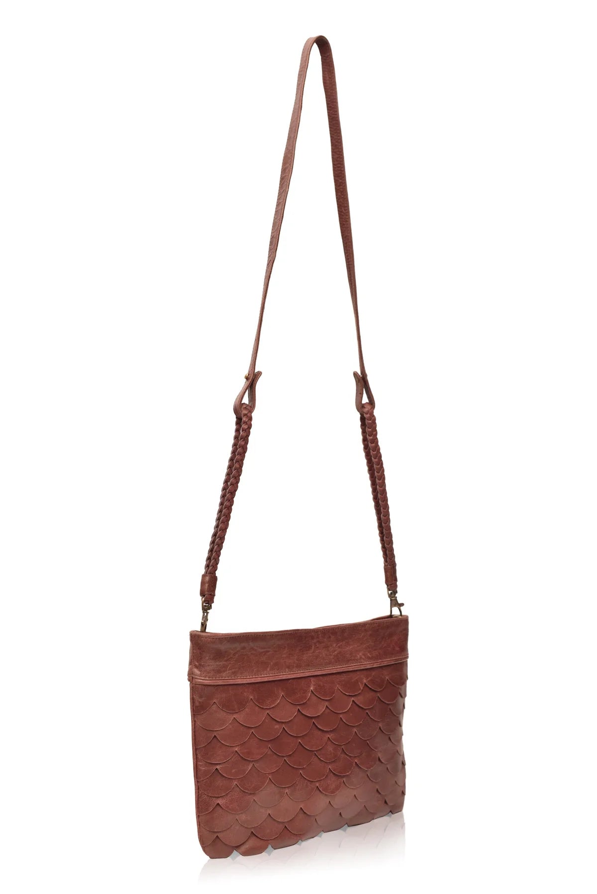 Side profile of the vintage brown Cascade Leather Crossbody Clutch with woven leather strap

