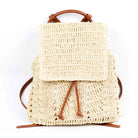 AVAH-front view of cream woven crochet backpack with brown leather straps
