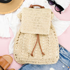 AVAH-close up of cream woven crochet backpack with brown leather straps