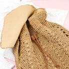 AVAH-front view khaki woven crochet backpack with brown leather straps