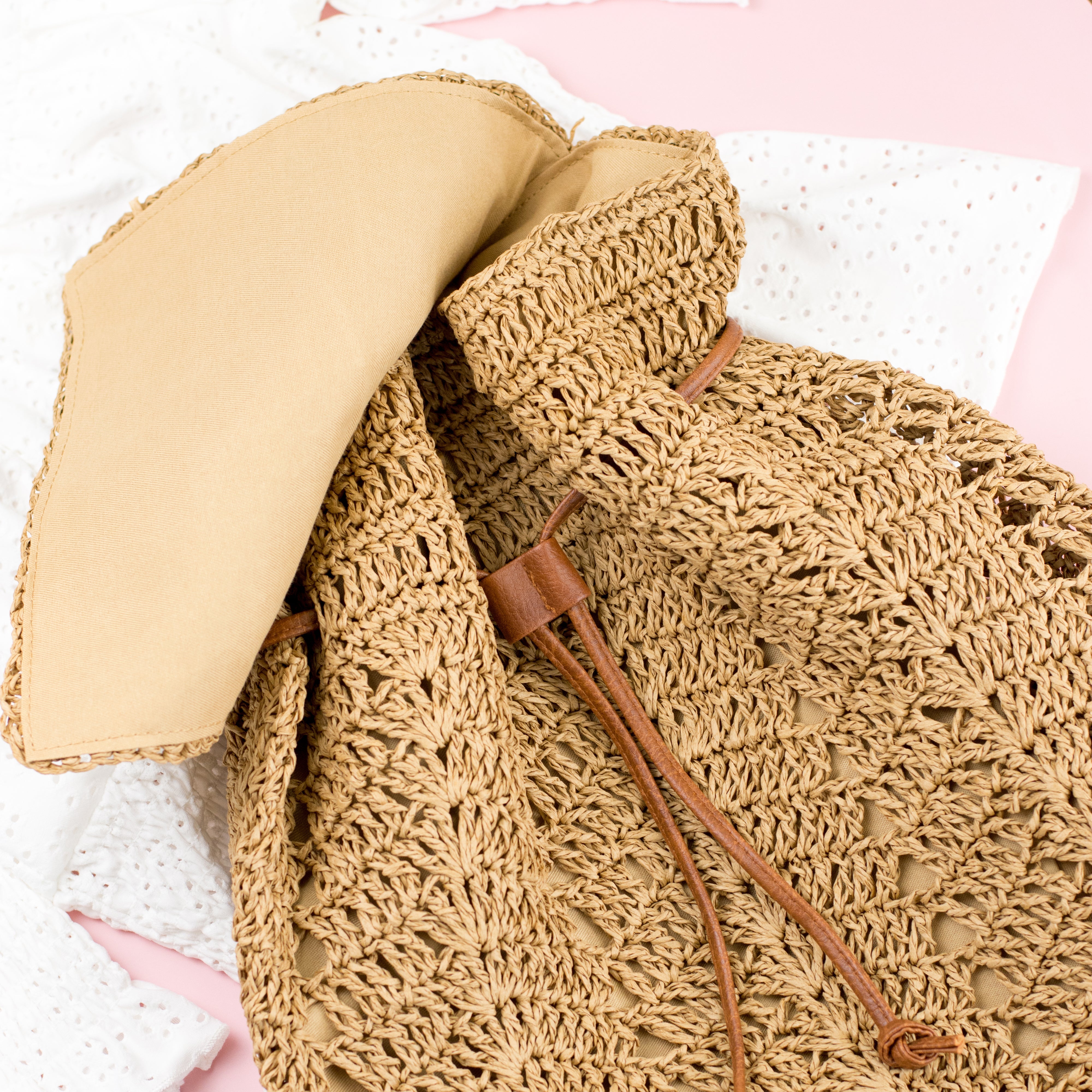 AVAH-front view khaki woven crochet backpack with brown leather straps