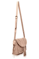 A light beige leather shoulder bag with a long strap, featuring a textured woven flap, braided strap details, and a tassel accent, shown against a plain white background.
