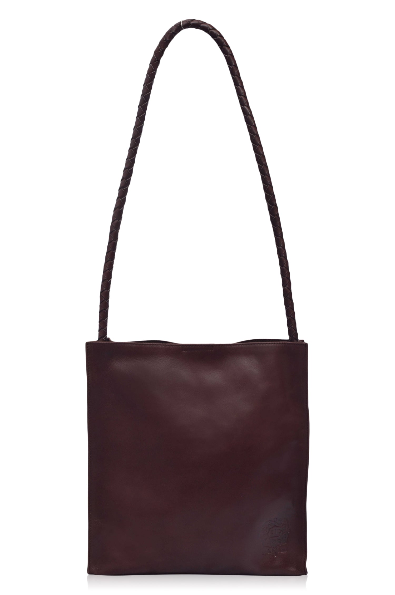 Minimal dark brown leather tote bag with a strap on a white background, front view