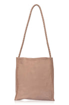 Beige tote bag with a rope handle on a white background