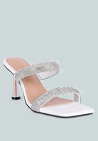 White high-heeled sandal with metallic heel, rhinestone details, and square toe on a white background, front angle view