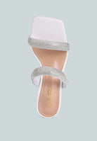 White high-heeled sandal with metallic heel, rhinestone details, and square toe on a white background, top view