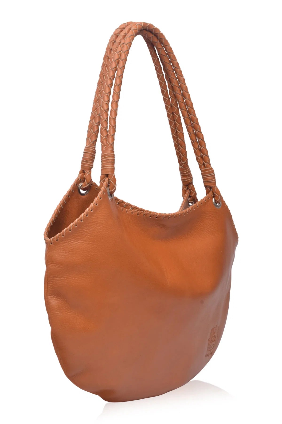 Camel leather handbag with braided handles on a white background