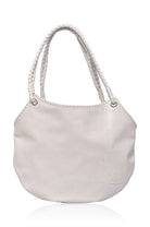 White leather handbag with rope handles, silver hardware and stitched detail on a white background