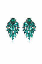 Emerald-green crystal cluster earrings in a tapered leaf-shaped arrangement on white background.