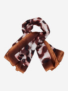 Folded scarf with brown and white pattern on a white background